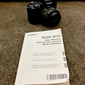 Canon EOS M50 with 15-45mm lens, RODE mic, and camera bag. Like brand new